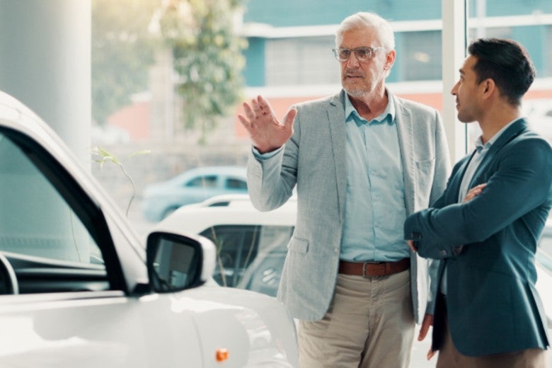 saleman talking about car to customer
